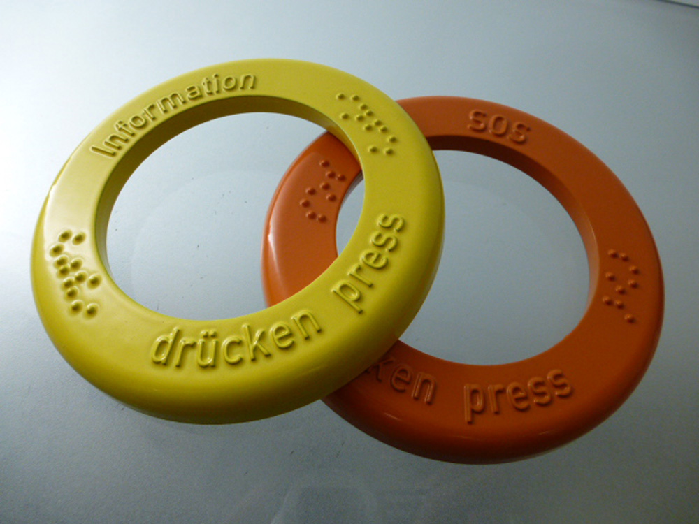 Pulverbeschichtete Druckgussteile mit Schriftprägung – DRUTEC Farbige Zinkdruckgussteile mit Pulverbeschichtung und Brailleschrift